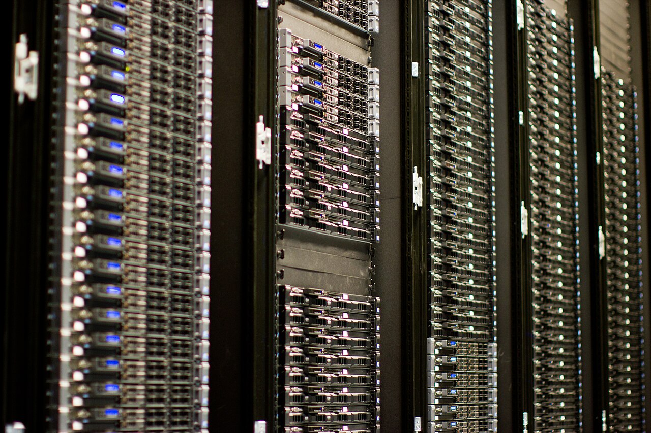 Row upon row of server hardware in a Wikimedia Foundation data centre.